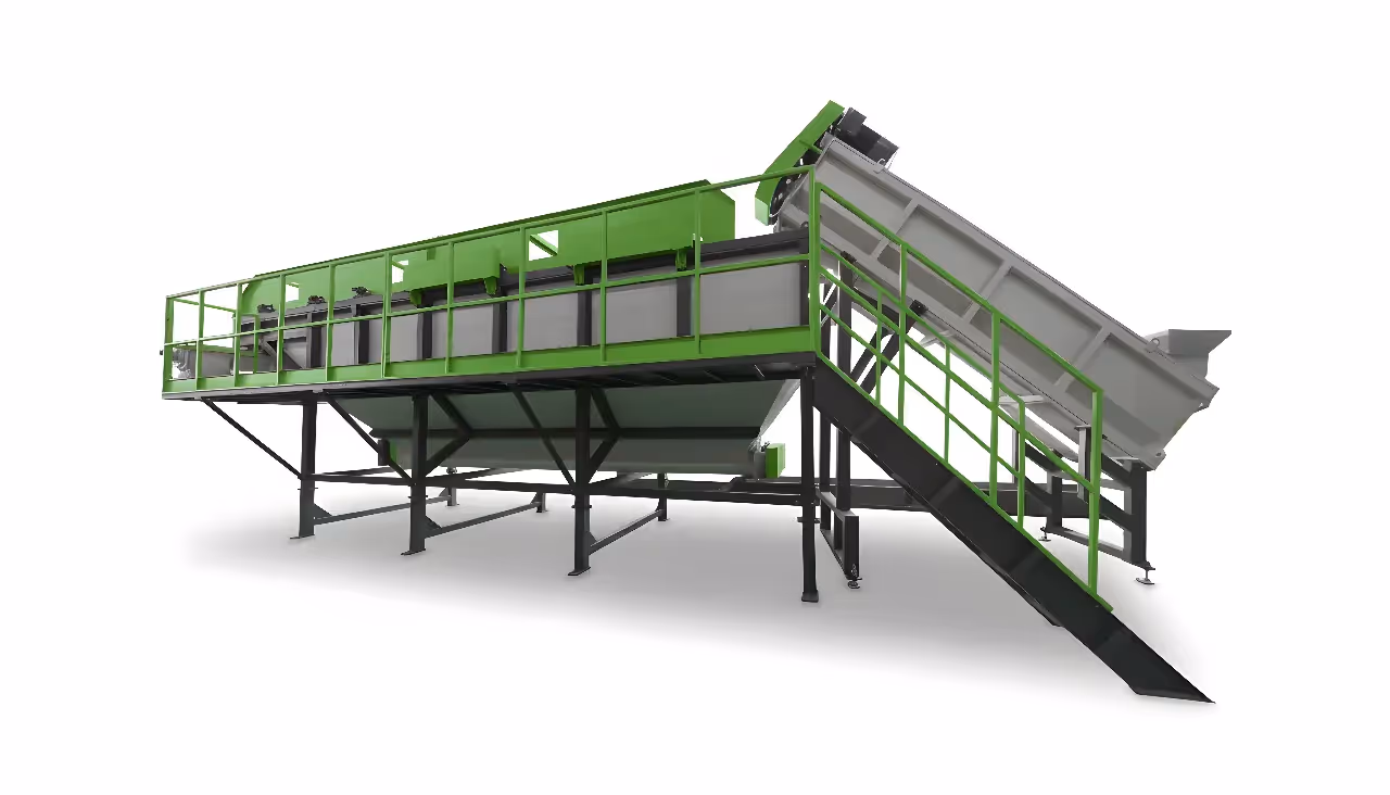 An industrial float-sink tank for rigid plastic recycling, serving as a pre-wash system and a density separator, shown with its large infeed conveyor.